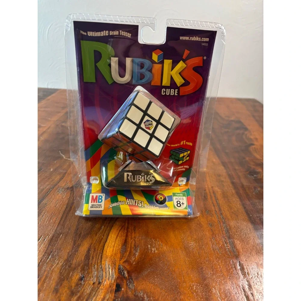 Milton Bradley Rubiks Cube 3x3 Puzzle with Stand and Booklet 54033 New Sealed